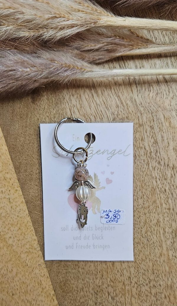 Schutzengel mit einem Eulen Anhänger rosegold